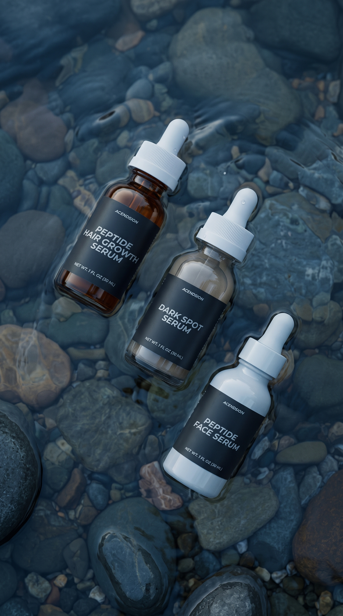 Three Acendsion peptide serum bottles on wet river stones