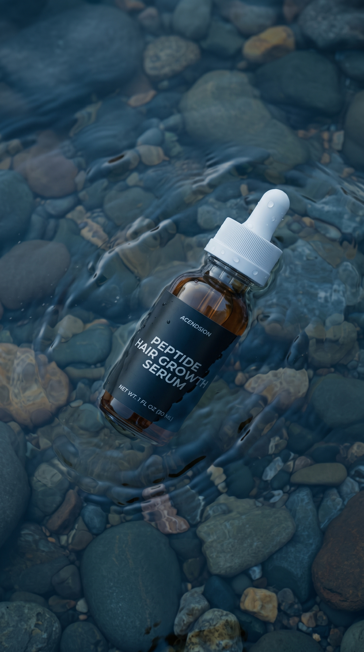 Peptide hair growth serum bottle on wet river stones
