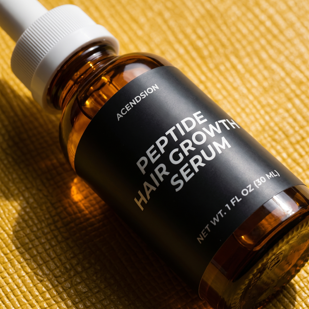 Close-up of the peptide hair growth serum label
